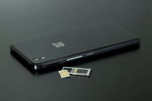 Black oneplus Smartphone on Black Table Top